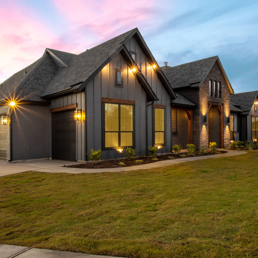 Exterior Modern Farmhouse at Dusk with Pink and Blue Sky From an