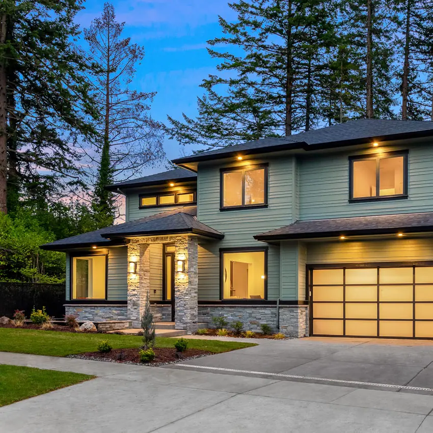 Beautiful modern luxury home exterior at sunset.